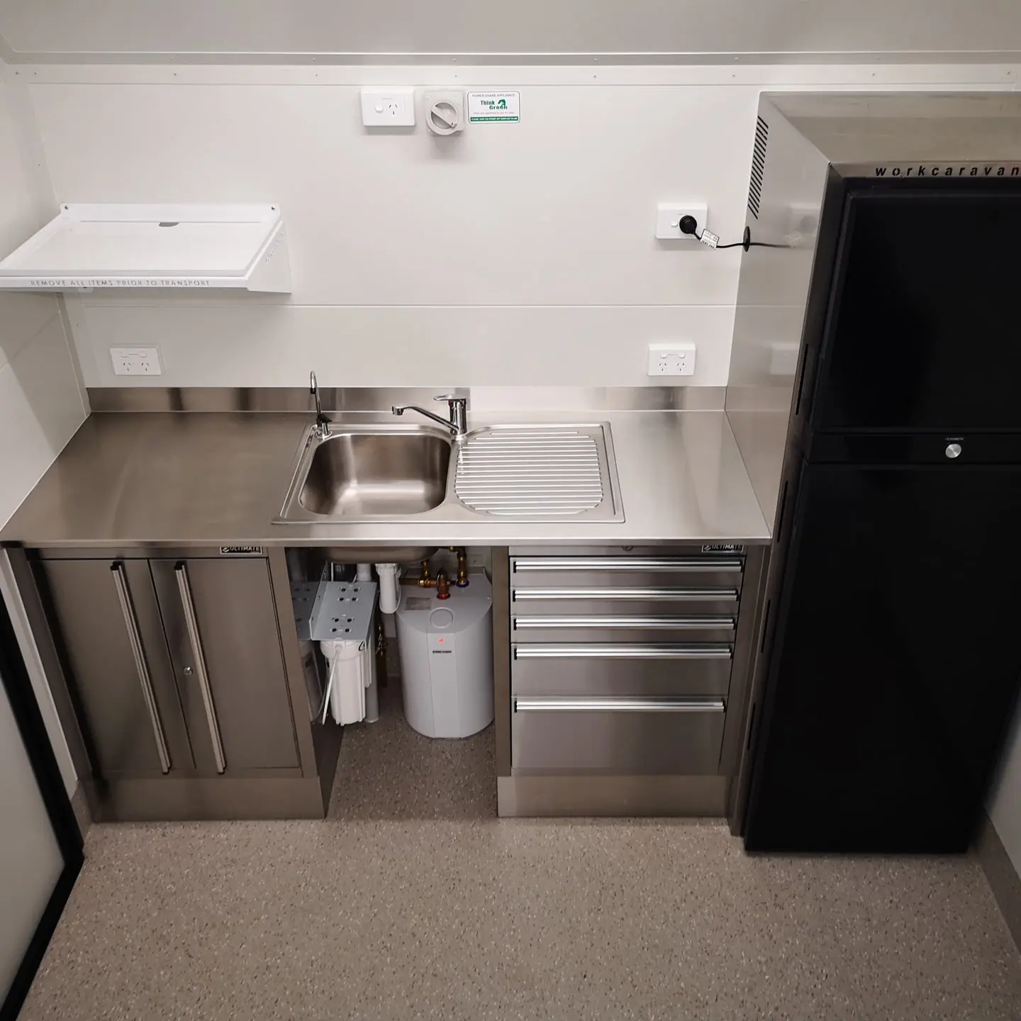 Inside features a kitchen skin, cabinets and fridge