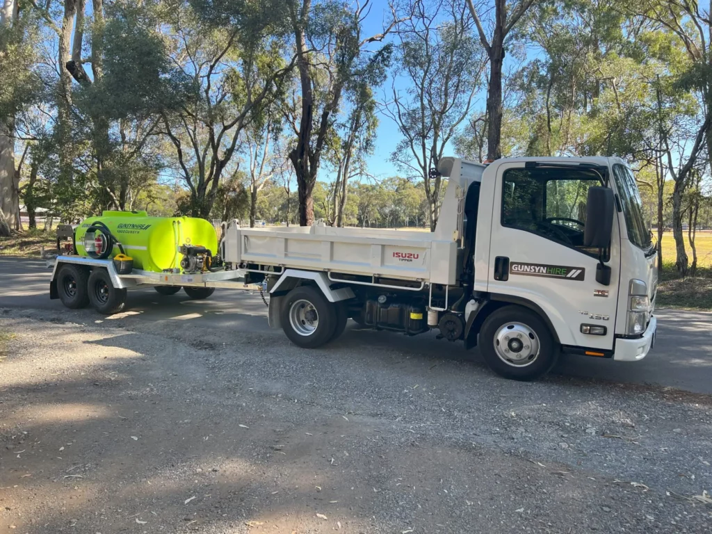 example of sprayer behind a small truck